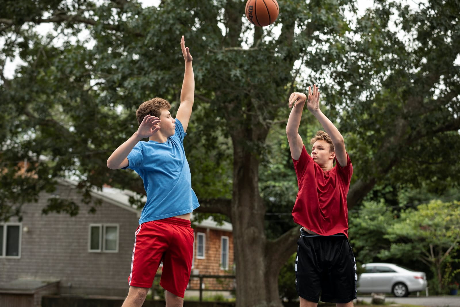 Logan_with_friend_playing_basketball4_horiz